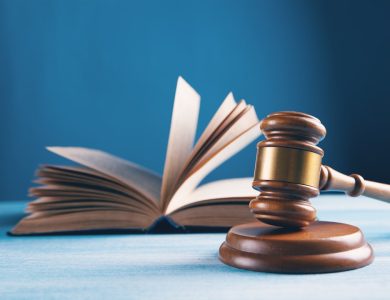 judges gavel and open book on table
