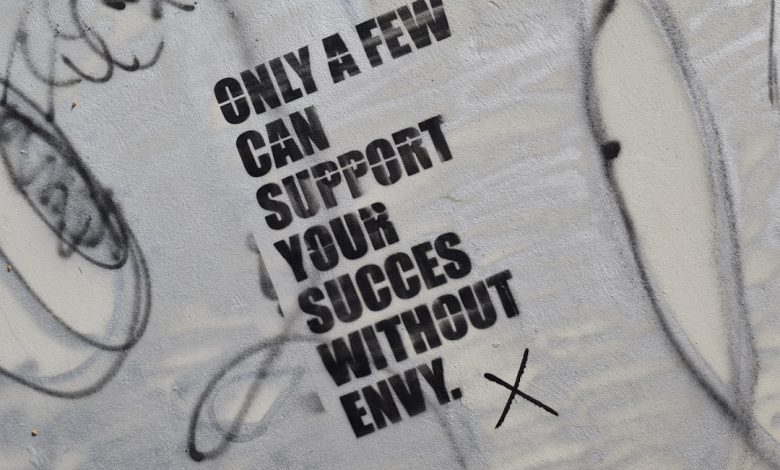 graffiti on the side of a wall that says only a few can support your success