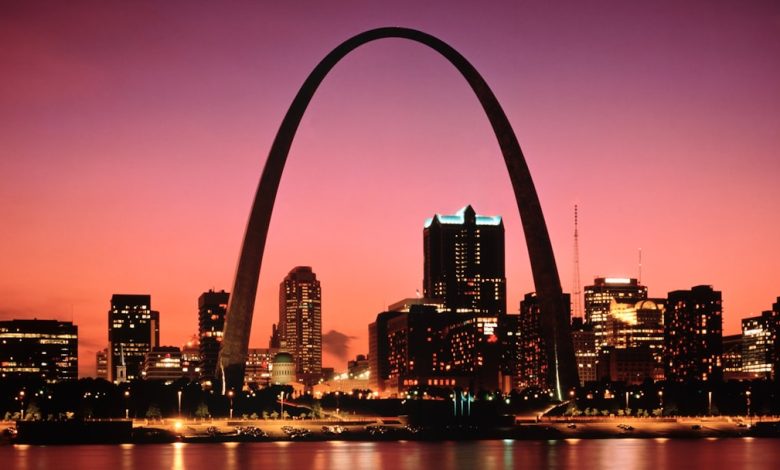 Gateway arch and st. louis skyline at sunset