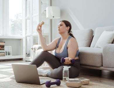 Plus-size woman exercising and making healthy choices in a cozy living room.