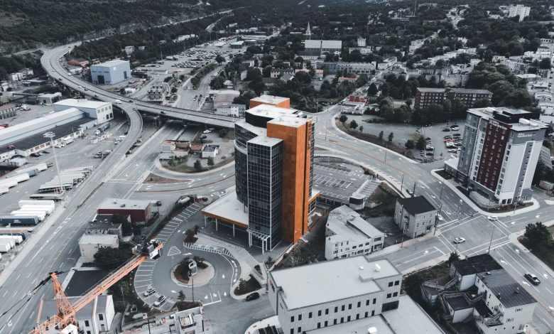 Drone photograph showcasing a cityscape with modern buildings and infrastructure.