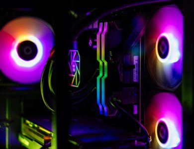 Close-up of a custom-built RGB gaming PC showcasing vibrant lighting and high-performance components.