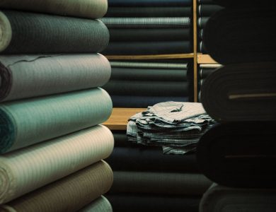 A variety of textile rolls on display in an İstanbul warehouse, showcasing fabric textures.