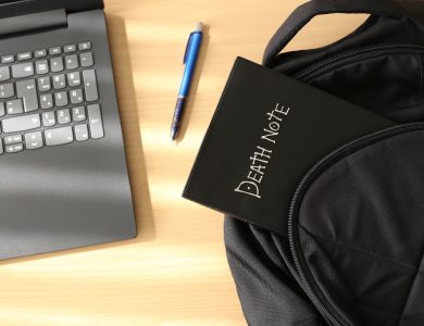 a bag and a laptop on a table
